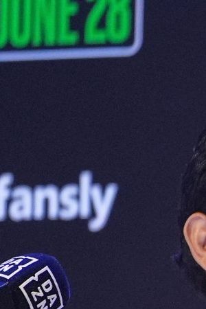 Boxers Cesar Chavez Jr,, left, smiles towards his father Julio Cesar Chavez, Mexico's former world champion, during a boxing news conference at the Avalon Hollywood Theatre in Los Angeles, Wednesday, May 14, 2025. (AP Photo/Damian Dovarganes)