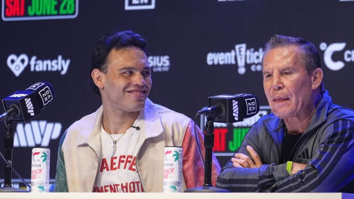 Boxers Cesar Chavez Jr,, left, smiles towards his father Julio Cesar Chavez, Mexico's former world champion, during a boxing news conference at the Avalon Hollywood Theatre in Los Angeles, Wednesday, May 14, 2025. (AP Photo/Damian Dovarganes)