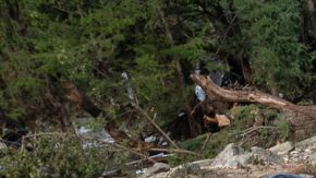 A crew of firefighters from Ciudad Acuna, Mexico, gather for a briefing as they aid in search and rescue efforts near the Guadalupe River after a flash flood swept through the area Monday, July 7, 2025, in Ingram, Texas. (AP Photo/Eli Hartman)
