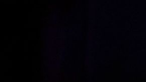 Cristela Alonzo on stage wearing a black dress