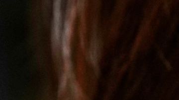 Diep Nguyen shows a Labubu doll to media during the opening of Germany's first shop for Labubu plush dolls in Berlin, Germany, Friday, July 25, 2025. (AP Photo/Markus Schreiber)