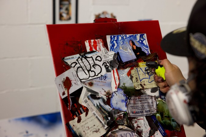 BXLYFE working on a canvas