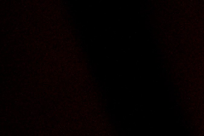 Bxlyfe working in front of an easel with a venilator on