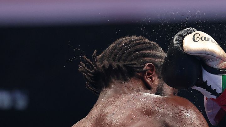 LAS VEGAS, NEVADA - SEPTEMBER 13: Canelo Alvarez throws a right punch at Terence Crawford in their undisputed super middleweight title fight during Netflix's Canelo v Crawford Fight Night at Allegiant Stadium on September 13, 2025 in Las Vegas, Nevada. (Photo by Sarah Stier/Getty Images for Netflix)