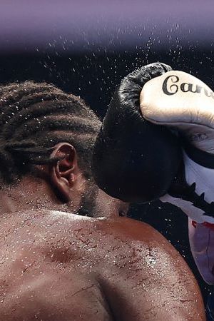 LAS VEGAS, NEVADA - SEPTEMBER 13: Canelo Alvarez throws a right punch at Terence Crawford in their undisputed super middleweight title fight during Netflix's Canelo v Crawford Fight Night at Allegiant Stadium on September 13, 2025 in Las Vegas, Nevada. (Photo by Sarah Stier/Getty Images for Netflix)
