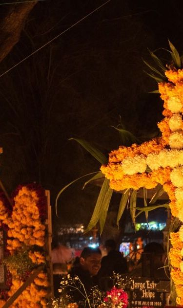 Tzintzuntzan,Michoacan; November 1 2022: Celebration of Day of the Dead with decoration of the cemetery and a candlelight vigil. One of the most important celebration in Mexico and the Lake Patzcuaro
