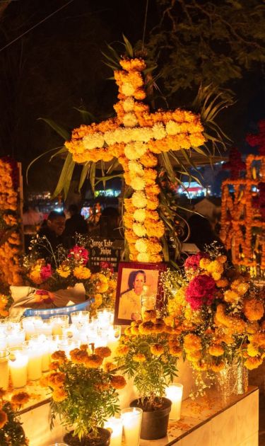 Tzintzuntzan,Michoacan; November 1 2022: Celebration of Day of the Dead with decoration of the cemetery and a candlelight vigil. One of the most important celebration in Mexico and the Lake Patzcuaro