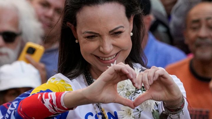 Opposition leader Maria Corina Machado gestures to supporters during a protest against President Nicolas Maduro the day before his inauguration for a third term, in Caracas, Venezuela, Thursday, Jan. 9, 2025. (AP Photo/Ariana Cubillos)