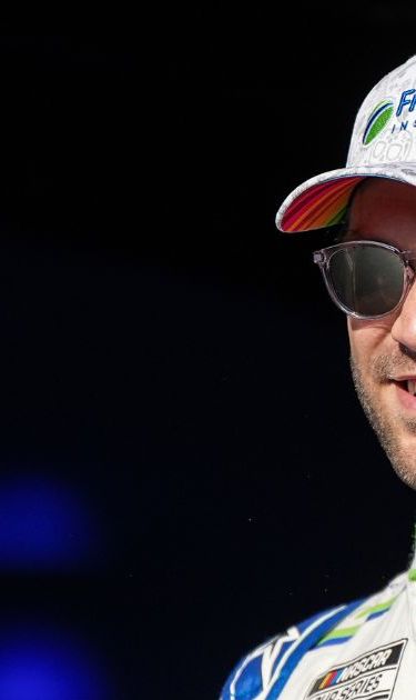 Daniel Suarez smiles prior to a NASCAR Cup Series auto race at Darlington Raceway, Sunday, Aug. 31, 2025, in Darlington, S.C. (AP Photo/Matt Kelley)