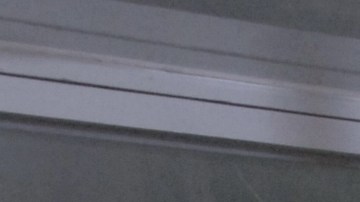 In this June 24, 2011 photo, Abraham Quintanilla, the father of late singer Selena, poses for pictures in front of the outfit that his daughter wore in her last concert in Corpus Christi, Texas. (AP Photo/Paul Iverson photo)