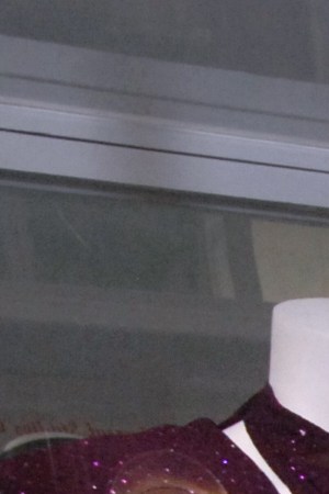 In this June 24, 2011 photo, Abraham Quintanilla, the father of late singer Selena, poses for pictures in front of the outfit that his daughter wore in her last concert in Corpus Christi, Texas. (AP Photo/Paul Iverson photo)