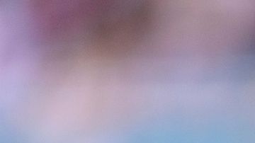 New England Patriots kicker Andy Borregales (36) smiles as he holds a football on the sidelines during an NFL football game against the Miami Dolphins, Saturday, Sept. 14, 2025, in Miami Gardens, Fla. (AP Photo/Doug Murray)