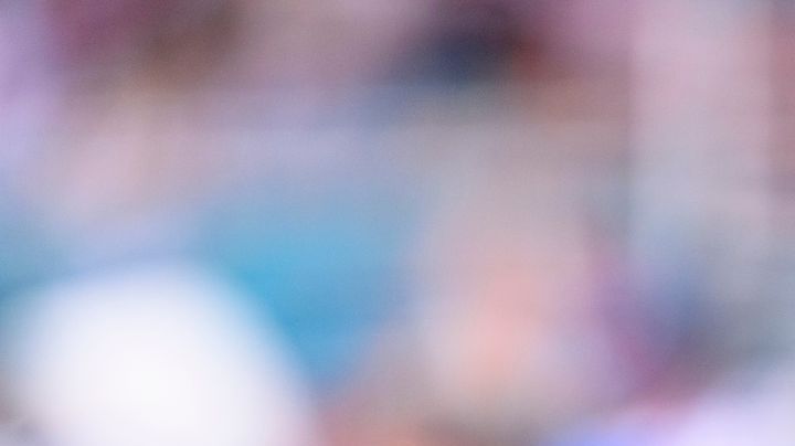 New England Patriots kicker Andy Borregales (36) smiles as he holds a football on the sidelines during an NFL football game against the Miami Dolphins, Saturday, Sept. 14, 2025, in Miami Gardens, Fla. (AP Photo/Doug Murray)