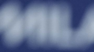 Gold medalist Alysa Liu of the United States displays her medal after competing in the women's free skate program in figure skating at the 2026 Winter Olympics, in Milan, Italy, Thursday, Feb. 19, 2026. (AP Photo/Stephanie Scarbrough)