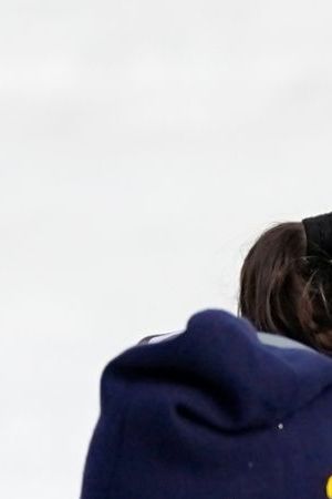 Regina Martinez Lorenzo, of Mexico, center, the last athlete to cross the finish line, is embraced by Bruna Moura, of Brazil, center left, and Jessie Diggins, of the United States, while silver medalist Ebba Andersson, of Sweden, left, and gold medalist Frida Karlsson, of Sweden, right, look on, at the end of the cross country skiing women's 10km interval start free at the 2026 Winter Olympics, in Tesero, Italy, Thursday, Feb. 12, 2026. (AP Photo/Matthias Schrader)