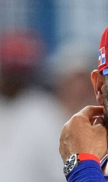 Title: WBC Netherlands Dominican Republic Baseball Image ID: 26067716703509 Article: Dominican Republic manager Albert Pujols stands on the field during the third inning of a World Baseball Classic game against the Netherlands, Sunday, March 8, 2026, in Miami. (AP Photo/Rebecca Blackwell)