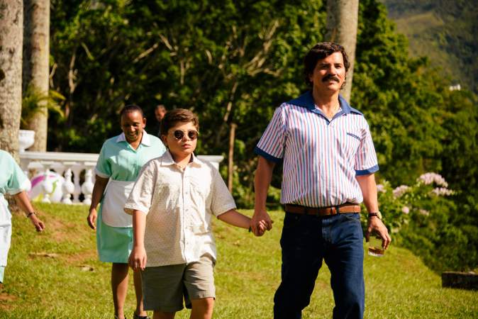 DEAR KILLER NANNIES – “Dear Killer Nannies” is a gripping coming-of-age series told through Juampi’s perspective as a child, the son of Colombia’s most notorious drug lord, Pablo Escobar Gaviria. As he grows up, Juampi’s world begins to fracture, shaped by his father’s expanding criminal empire and the constant presence of danger — embodied by the hitmen who serve as his “nannies.” Featuring a stellar cast including John Leguizamo as Pablo Escobar Gaviria, the series explores loyalty, fear, and the loss of innocence, revealing the human cost of a childhood spent inside one of history’s most infamous criminal legacies. (Courtesy of Disney) MIGUEL TAMAYO, JOHN LEGUIZAMO