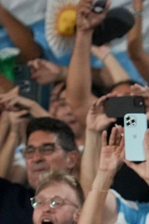 Title: Uruguay Argentina Wcup 2026 Soccer Image ID: 25081058101844 Article: Fans of Argentina celebrate as their team defeated Uruguay during a qualifying soccer match for the FIFA World Cup 2026 in Montevideo, Uruguay, Friday, March 21, 2025. (AP Photo/Matilde Campodonico)