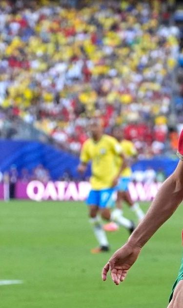 Brazil's Vinicius Junior (7) challenges for the ball with Morocco's Achraf Hakimi (2) during the World Cup Group C soccer match between Brazil and Morocco in East Rutherford, N.J., near New York, Saturday, June 13, 2026. (AP Photo/Yuki Iwanmura)