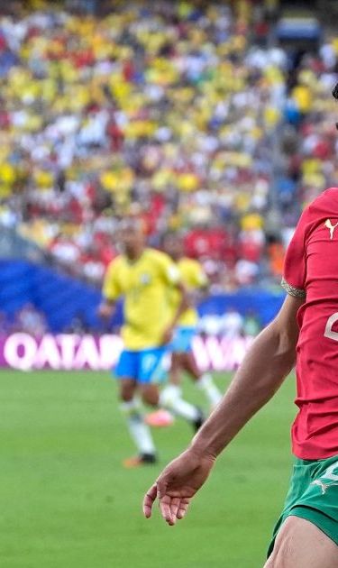 Brazil's Vinicius Junior (7) challenges for the ball with Morocco's Achraf Hakimi (2) during the World Cup Group C soccer match between Brazil and Morocco in East Rutherford, N.J., near New York, Saturday, June 13, 2026. (AP Photo/Yuki Iwanmura)