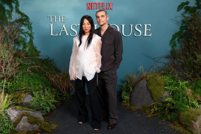 LONDON, ENGLAND - AUGUST 02: 'Wagner Moura' & 'Greta Lee' attend the photo call for "The Last House" at The Soho Hotel on August 02, 2026 in London, England. (Photo by Tim P. Whitby/Getty Images for Netflix)