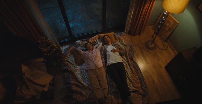The Last House. (L-R) Greta Lee as Ann and Wagner Moura as Jason in The Last House. Cr. Courtesy Netflix © 2026